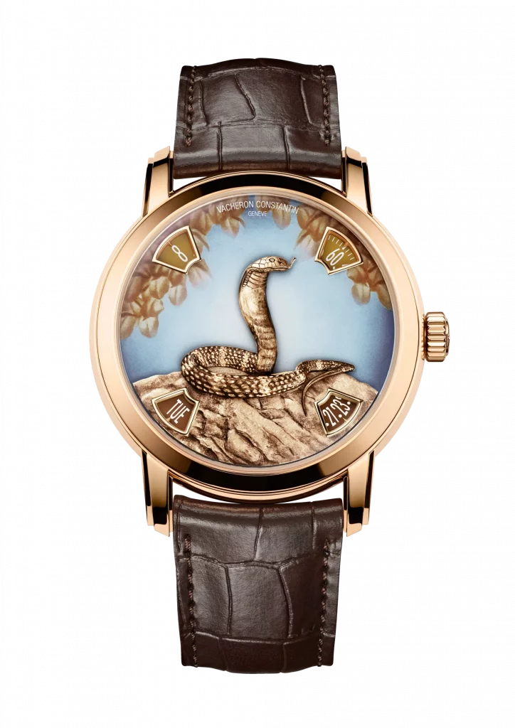 Vacheron Constantin Métiers d’Art Year of the Snake mit graviertem Schlangenmotiv auf dem Zifferblatt, luxuriöses Weißgoldgehäuse und Alligatorlederarmband.